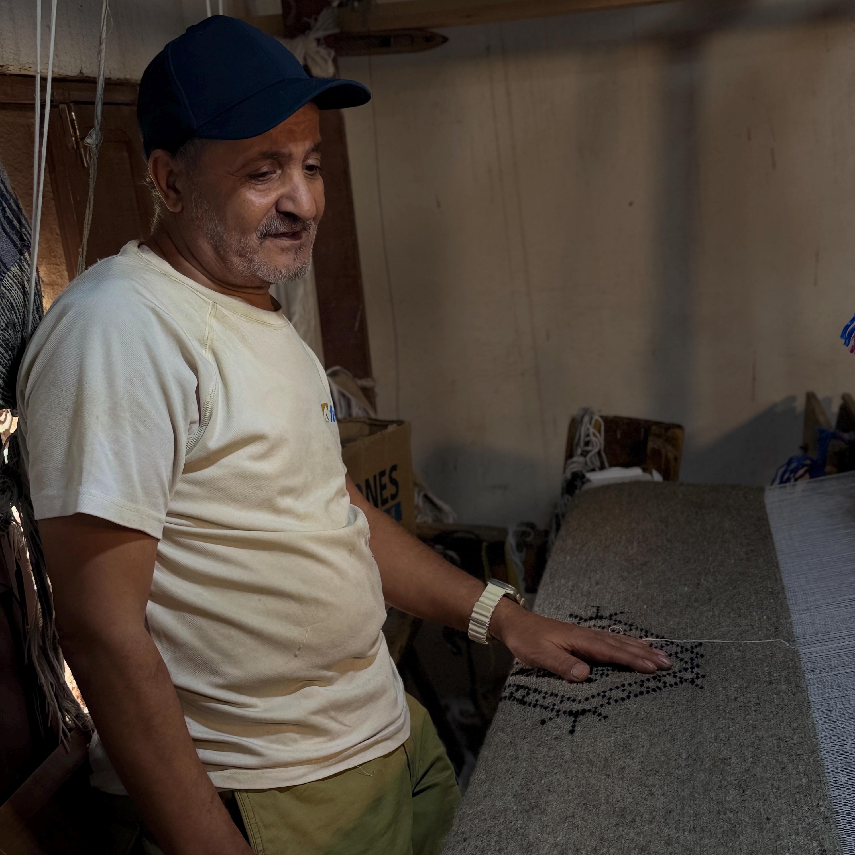 Figure 4. My father, smiling at the piece he is finishing. This is what the work looks like when it is treated as a profession rather than a survival.