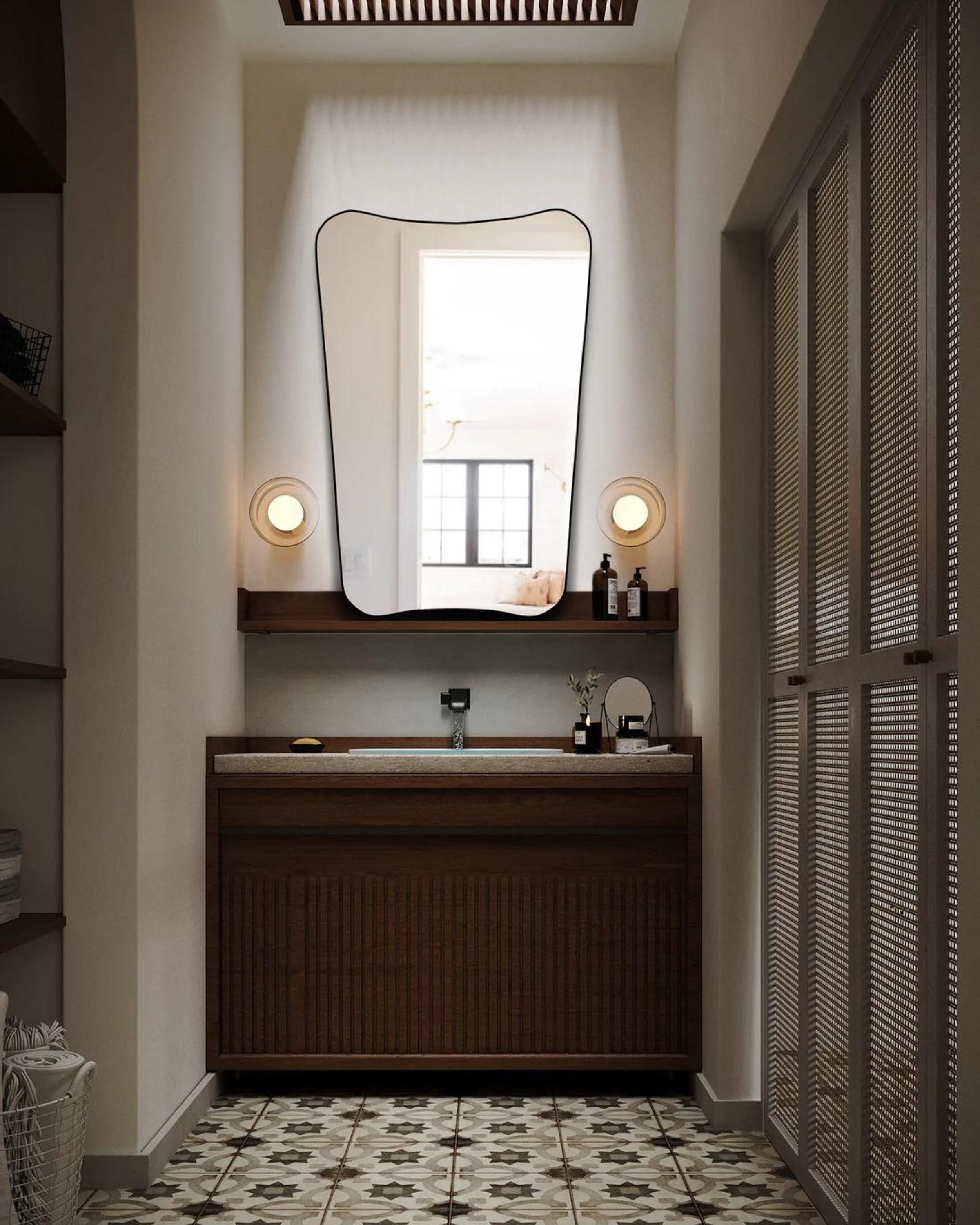 Gio Ponti F.A. 33 Mirror hung on the wall of a powder room