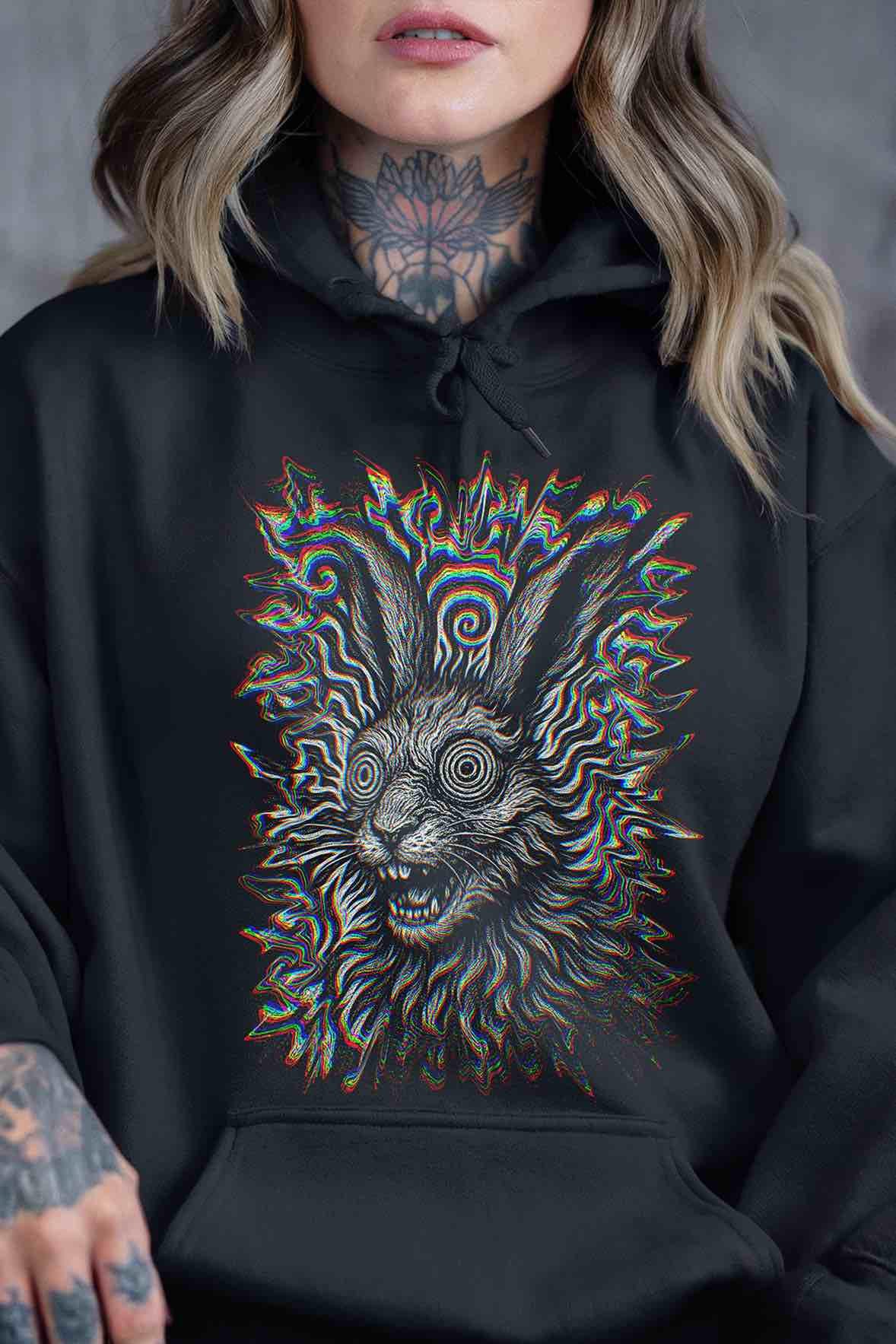 Black Hoodie mockup (on-model): Unisex black hoodie with kangaroo pocket and front-center psychedelic rabbit print; bold under stage lights; built for rave layering and streetwear styling.