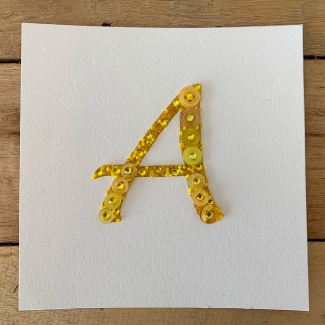 Cursive capital letter A