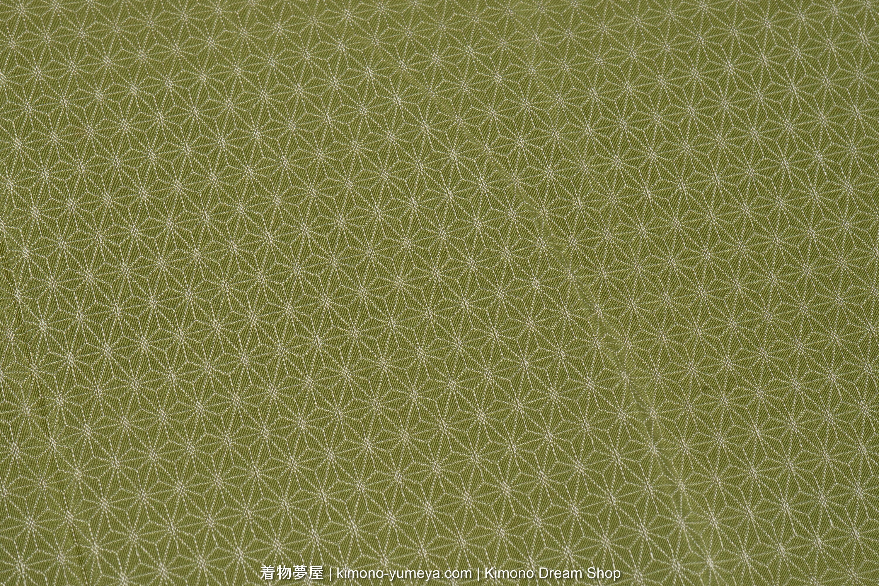 Repeating geometric hemp leaf pattern, made of beige lines on green.