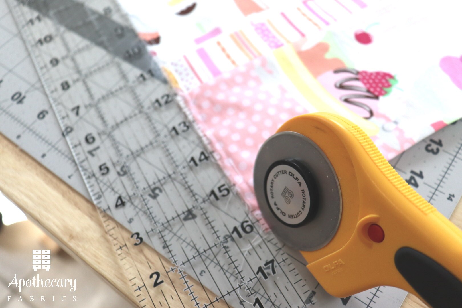 Cutting the 1/4 seam allowance down to 1/8 with a ruler and rotary cutter.