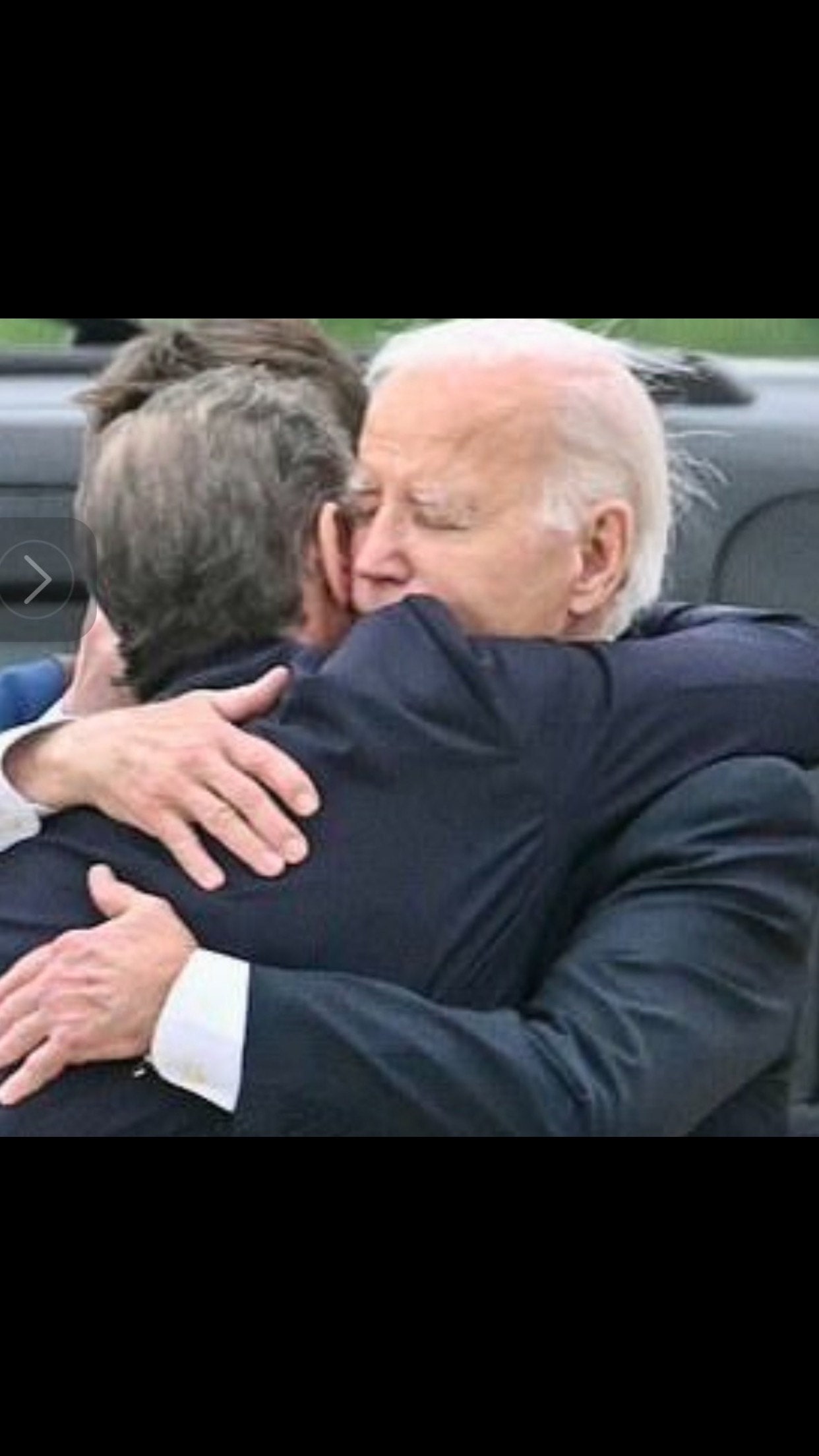 A Father standing by his son.