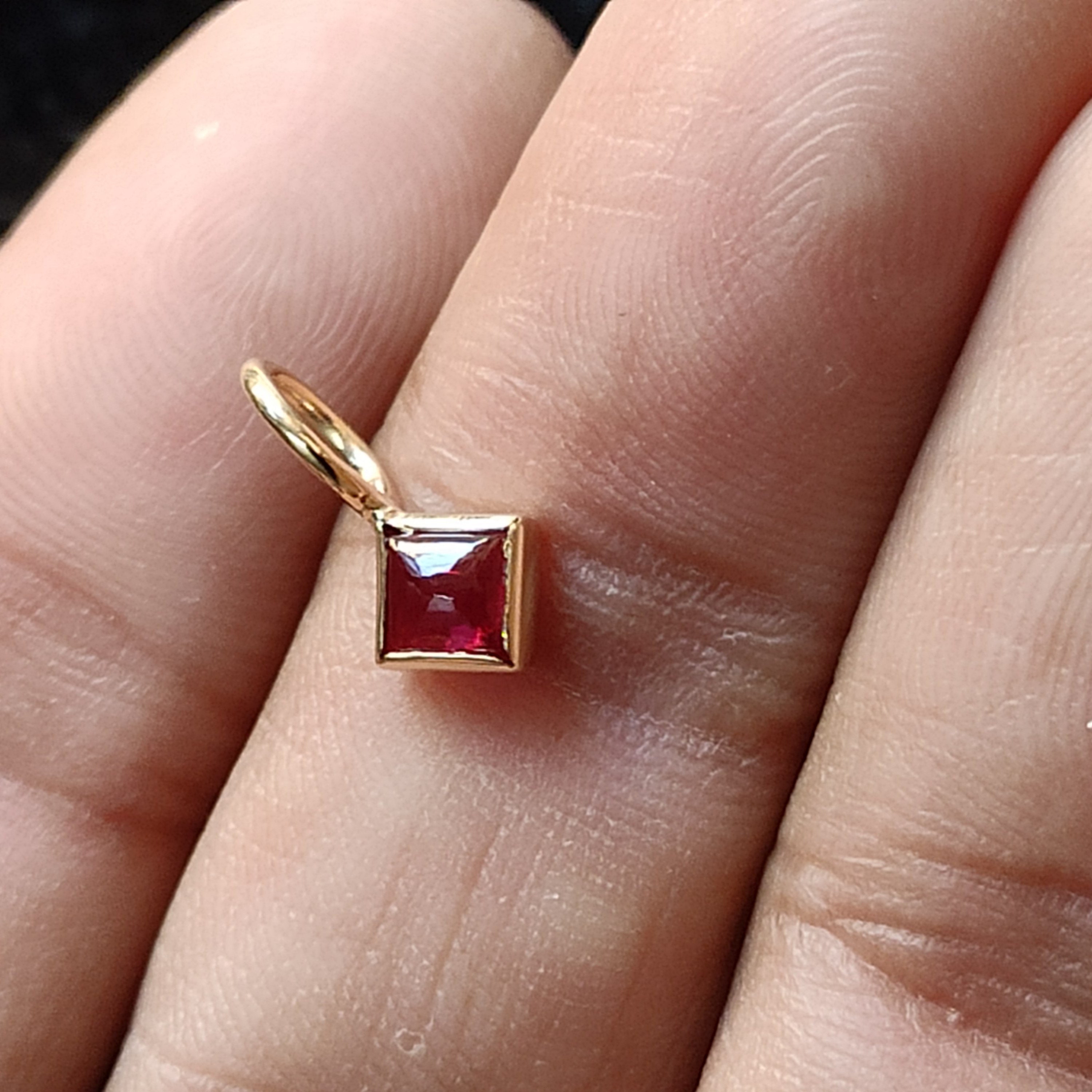 Bezel set Ruby Charm in 14k solid gold