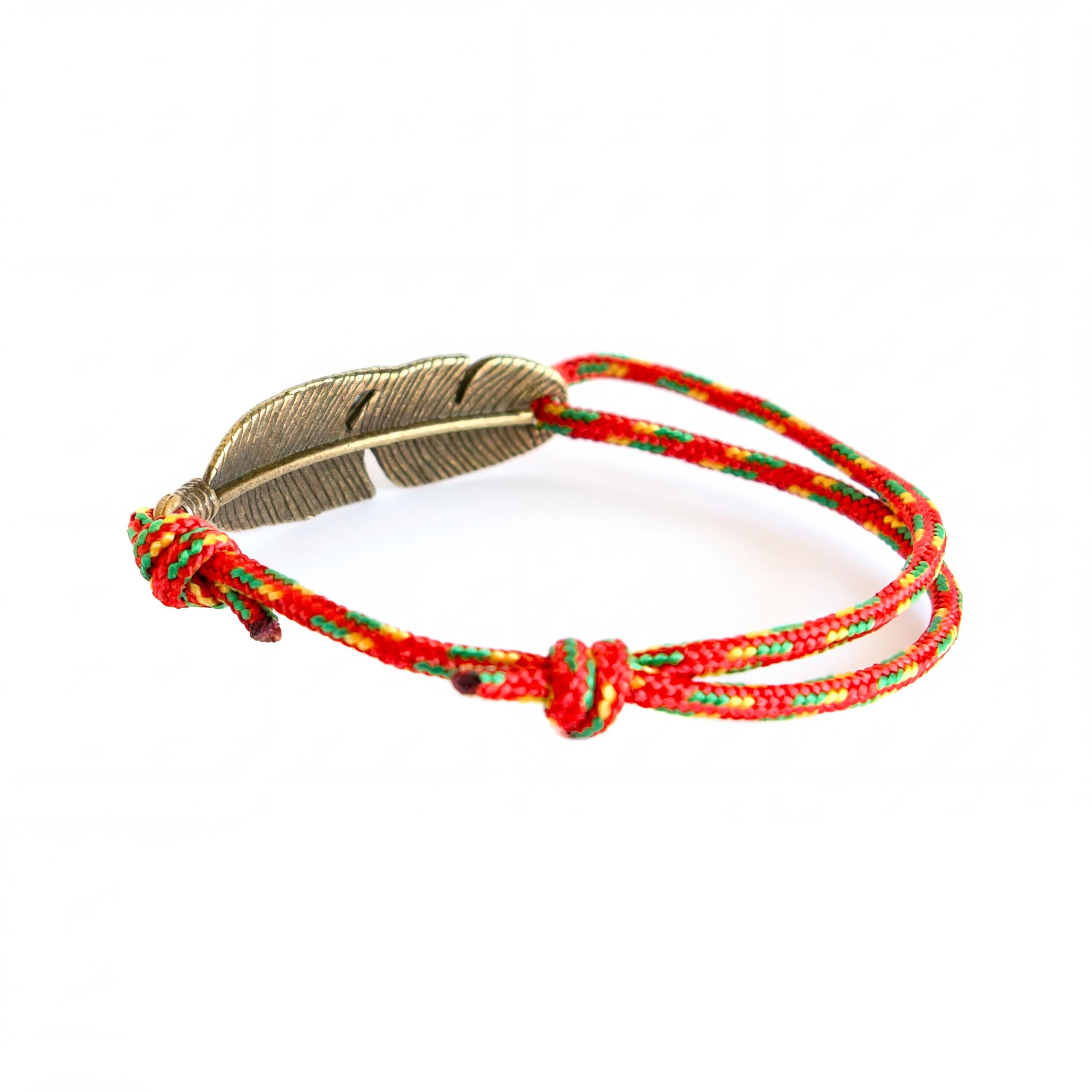 Minimalist unisex rope bracelet designed for men and women, combining surfer aesthetic with climbing rope durability and natural feather charm detail.