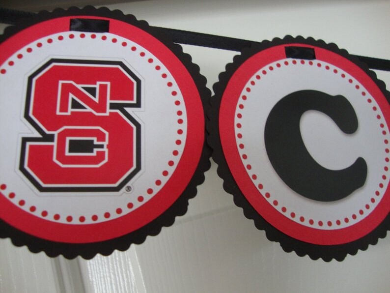 red and black North Carolina State graduation banner