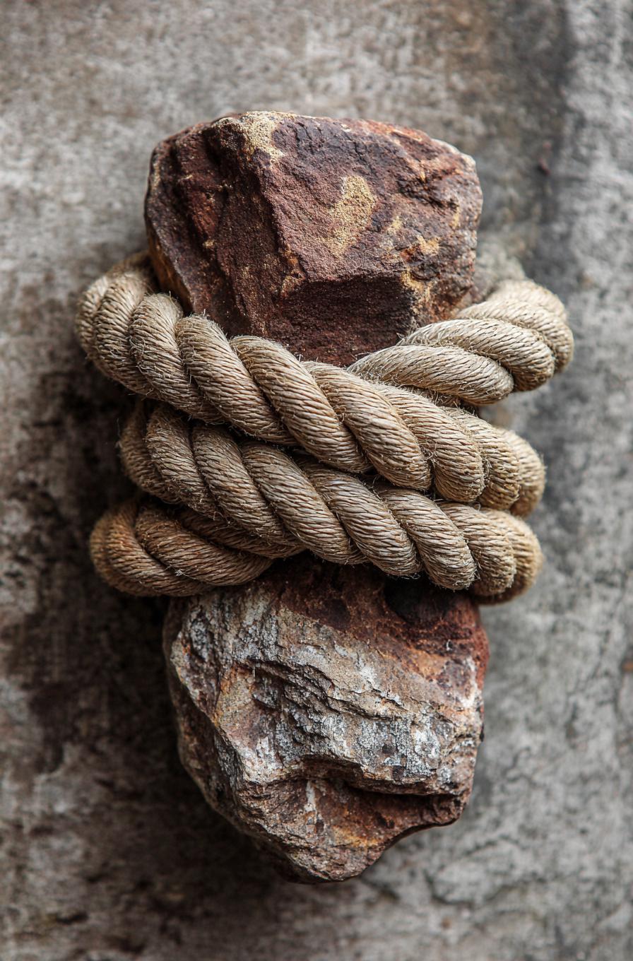 A sea rock wrapped in ships rope