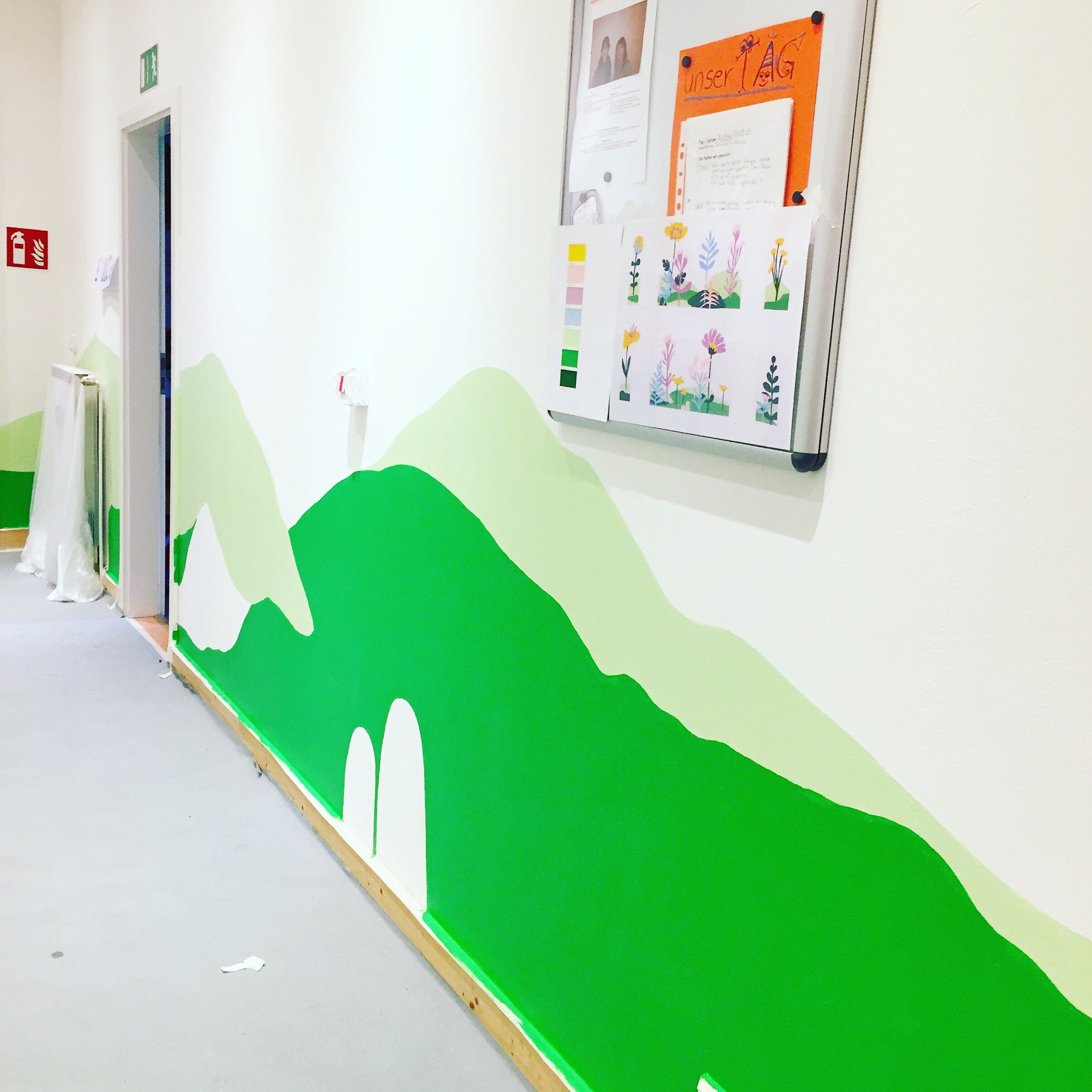 boatandballoon painting progress on kindergarten mural