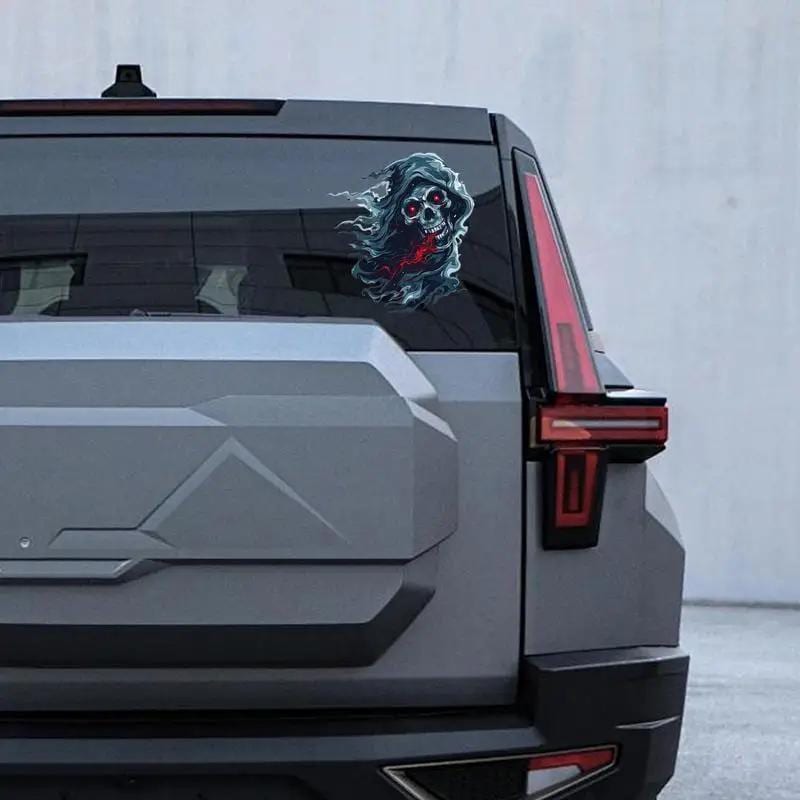Ghost skull sticker on SUV rear window.