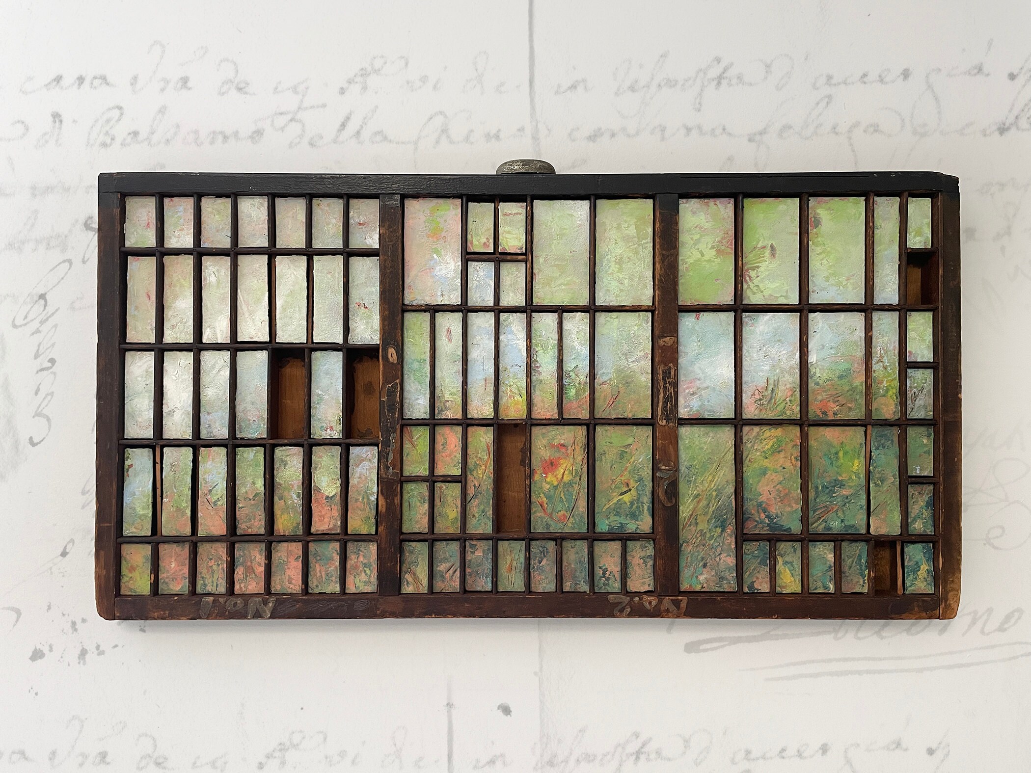 painting in antique printer tray