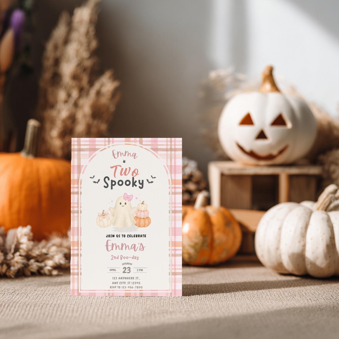 Pink Two Spooky second birthday invitation mockup with a friendly ghost, pumpkins, gingham details, and playful Halloween colors.