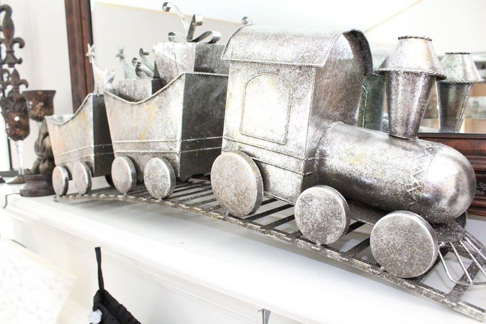 Christmas Train on white fireplace mantel.