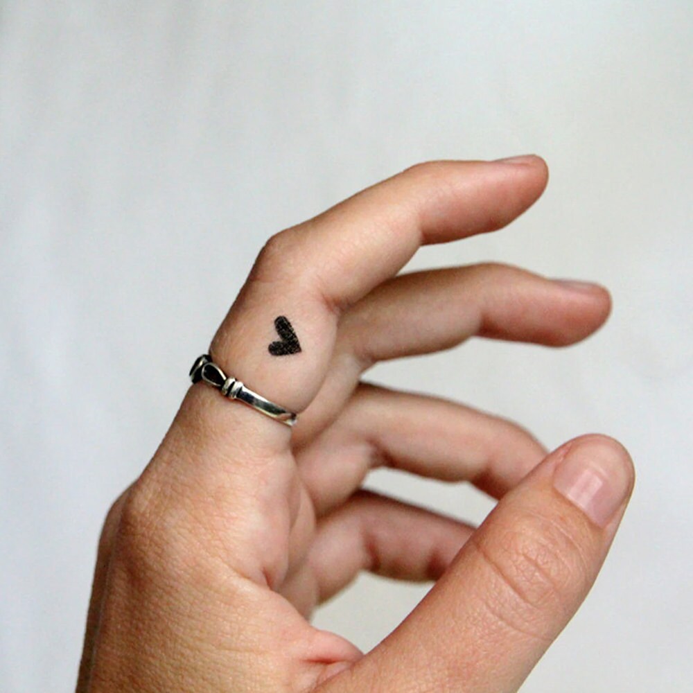 heart finger tattoo