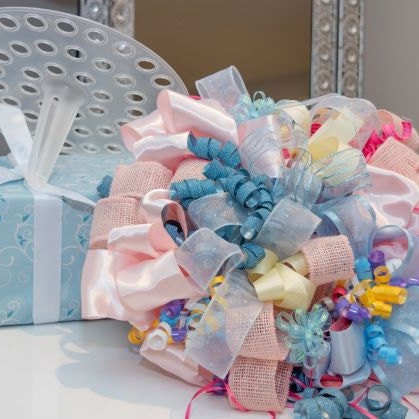 Bridal shower bouquet using all the wrapping paper, ribbons