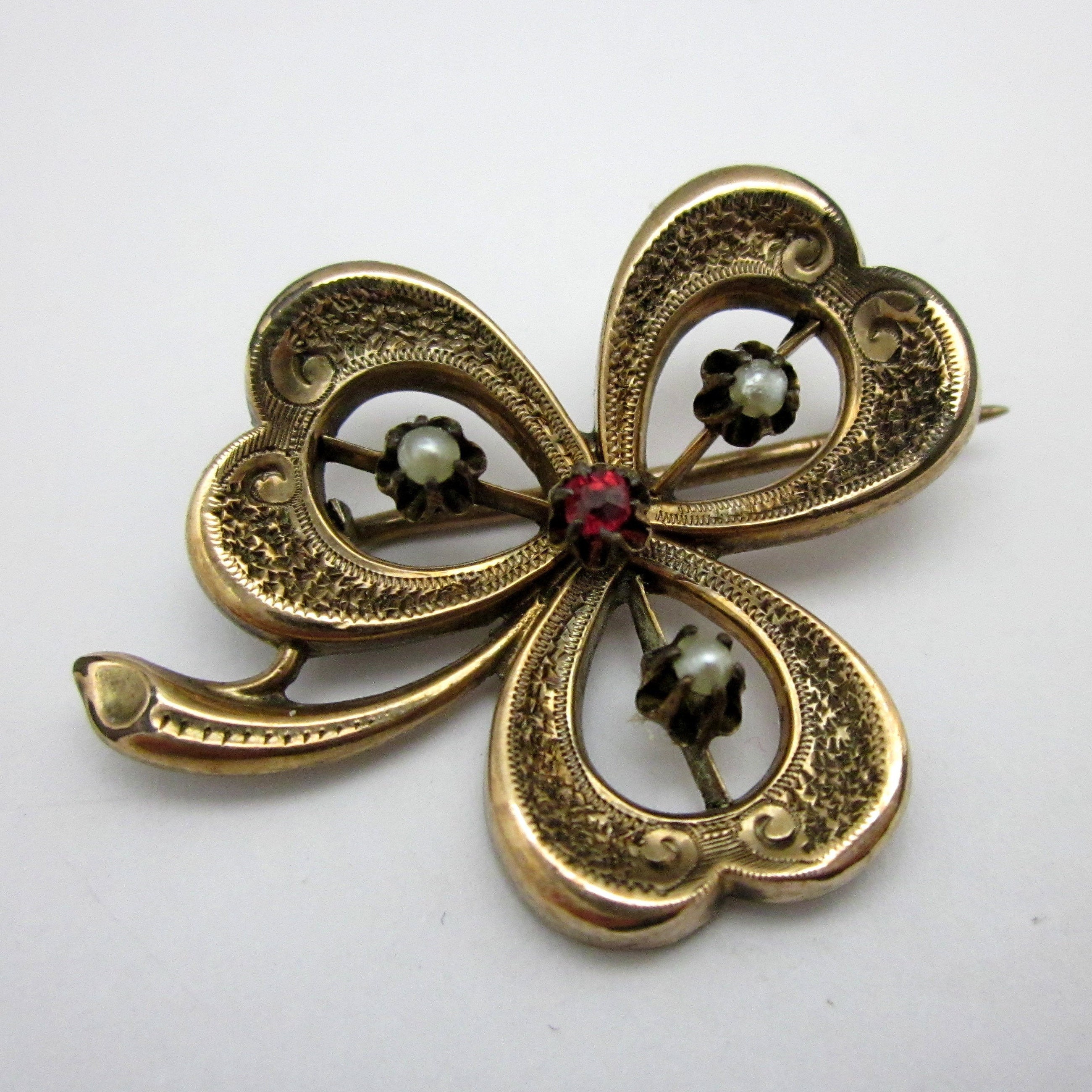 Antique Curved Scarf Pin with Purple Glass Gem and Vine Motif -  Copperfield's Gifts & Rarities