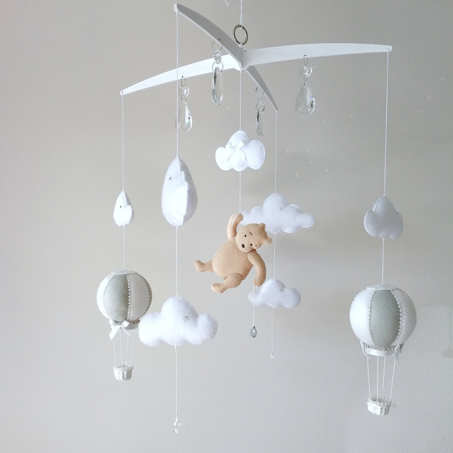 grey and white cot mobile