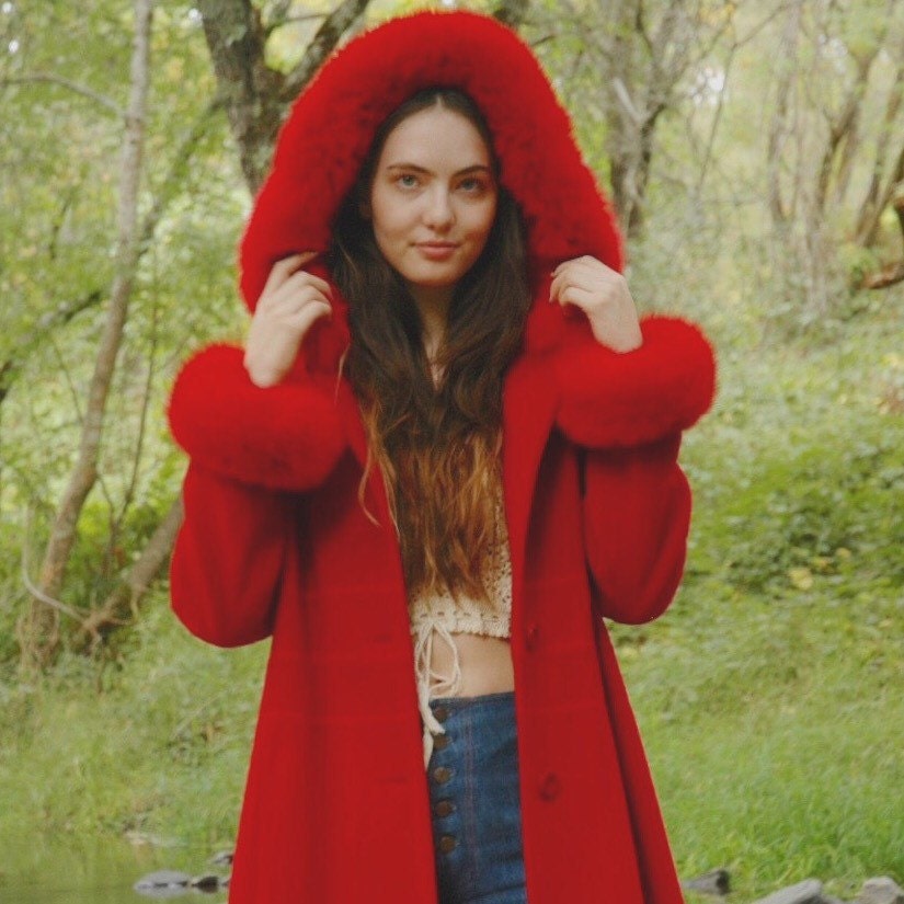 red coat with fur trim hood